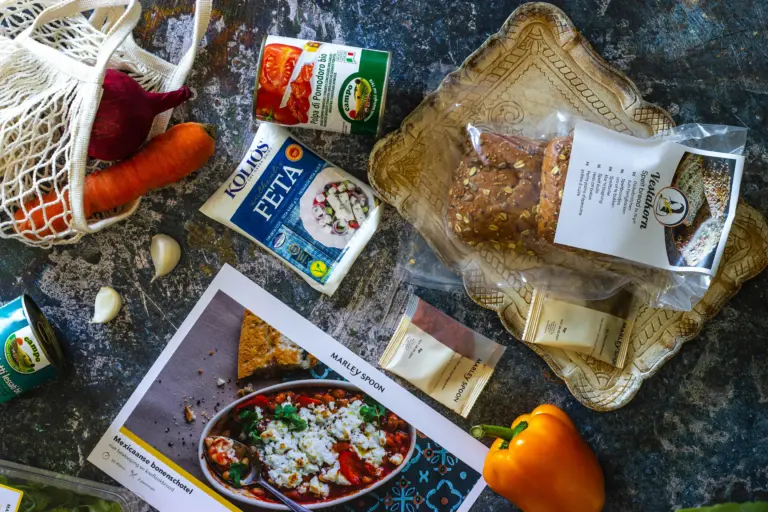 Meal kit subscription flexibility portal showing skip, swap, pause, resize, cut-off deadline, next delivery, and kitchen production updates.