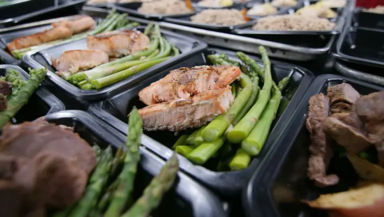 Mobile meal prep Sunday conversion screen showing postcode checker, next delivery date, cut-off, meal menu, subscription flexibility, and checkout button.